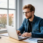 Home 18 재정적 자립을 위한 준비 과정 - A cozy modern home office scene in Germany, featuring a young adult diligently analyzing monthly exp...